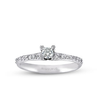 Solitär Ring aus Gold mit einem Diamanten und weiteren Brillanten auf der Ringschiene.